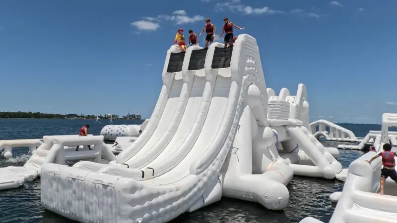 Guests at the top of Aqua Warrior's triple slide