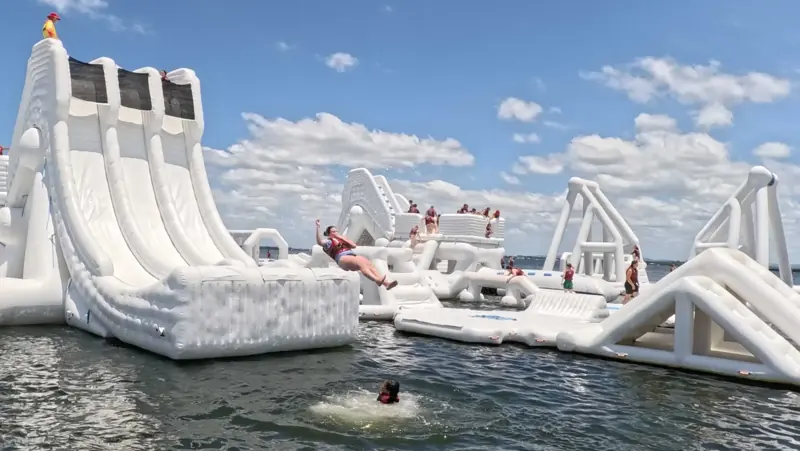 Wide view of Aqua Warrior's floating obstacles and guests