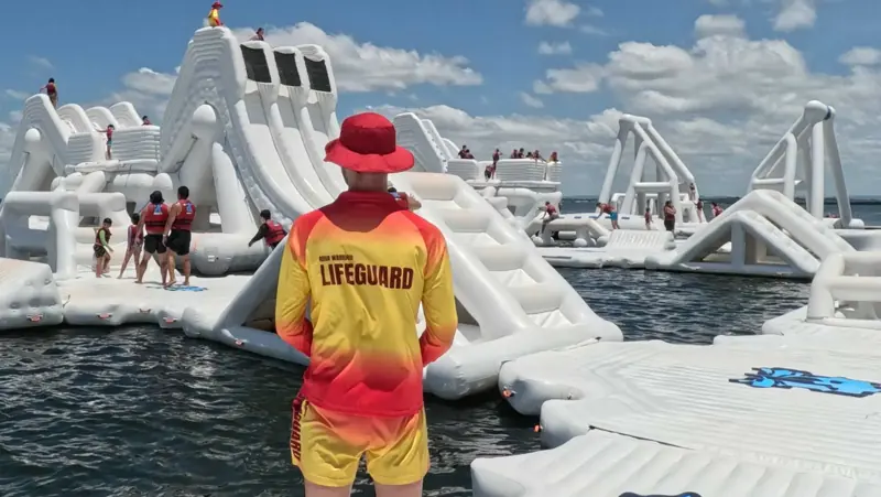Aqua Warrior lifeguard watching guests across the course
