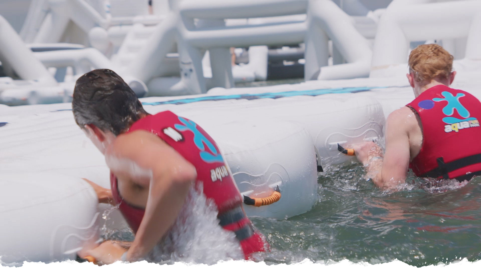 Two Aqua Warrior participants working through a shared water challenge