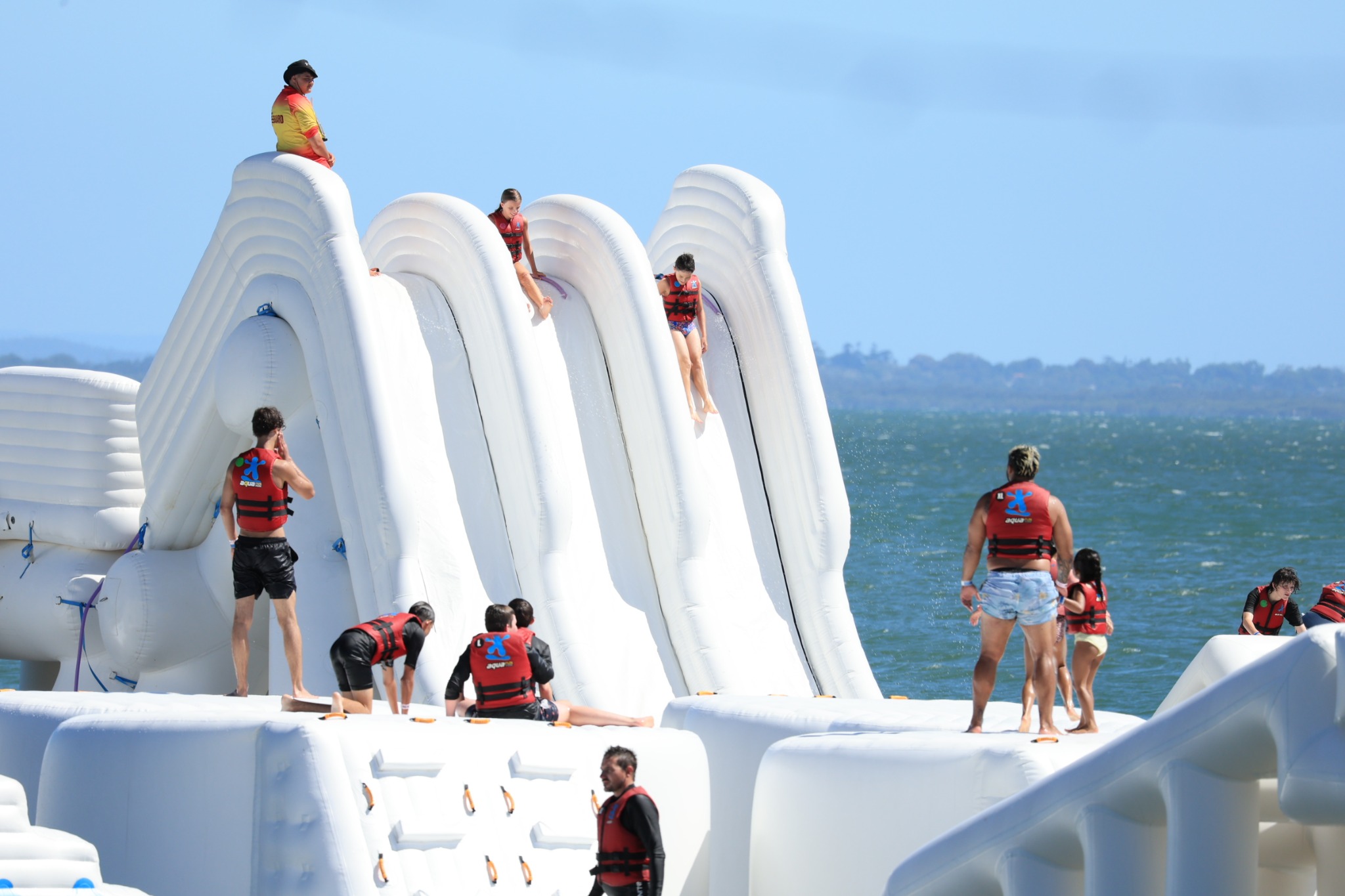 Aqua Warrior guests descending the triple slide